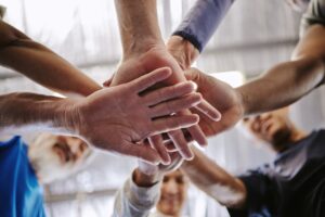 Hands together as teamwork concept