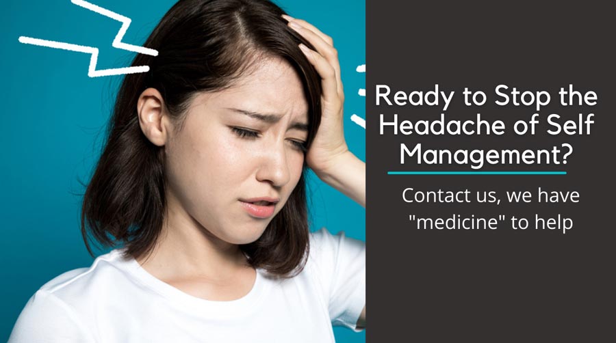 grimacing woman holding her head